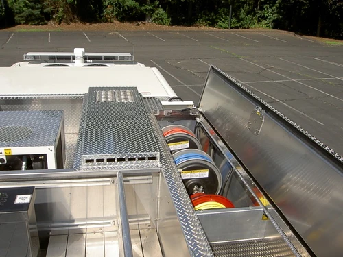 Top deck view showing hosebed walkways, crosslay covers, and deck surfaces