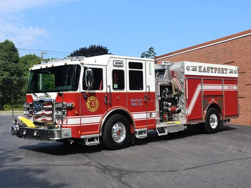 Pumper front-left exterior view showing cab, grille, and side body