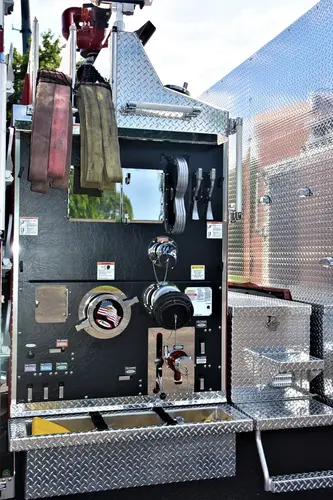 Open pump-side panel showing intake controls and fittings