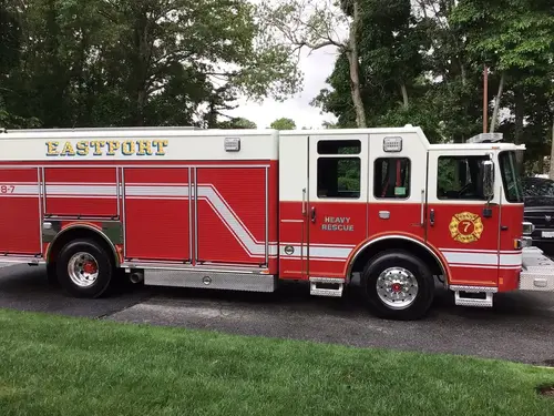Driver-side profile view showing pump panel and body compartments