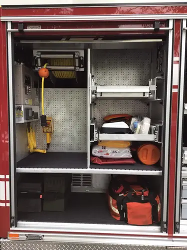 Open compartment with pull-out tray and center passthrough opening