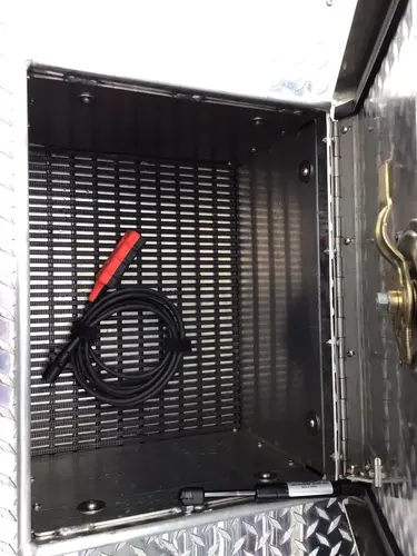 Narrow vertical compartment with mounted rope bag and hand tool