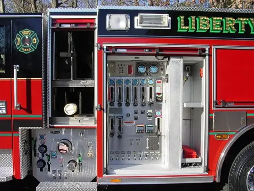Pump panel close-up showing gauges, valves, and control levers