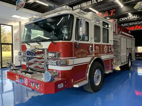 Front-left exterior view showing cab corner and side body profile