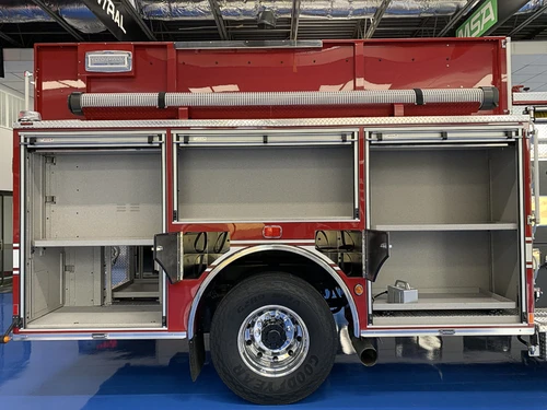 Driver-side profile with closed roll-up doors and wheel area