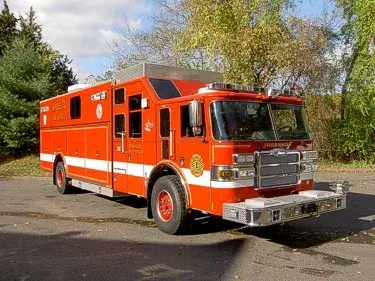 Front-left exterior view of heavy rescue truck showing long body and cab section