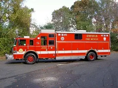 Passenger-side full profile showing long rescue body and side compartments