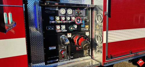 Pump panel close-up showing gauges, valves, and intake controls