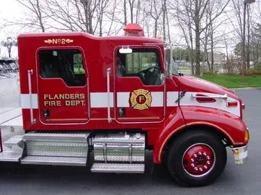 Passenger-side cab close-up showing crew doors and front wheel area