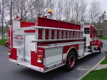 Rear-right exterior view showing long roof ladder rack and side compartments