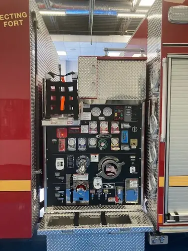 Pump panel close-up showing gauges, valves, and control levers