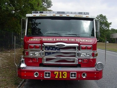 Front exterior view showing grille, bumper, and warning lights