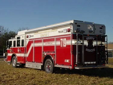 Rear-right exterior view showing rear door panel and side compartment layout