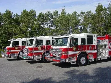 Pumper lineup front-left view showing multiple apparatus parked together