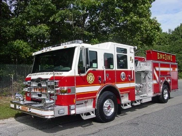 Front-left exterior view showing cab and side compartments