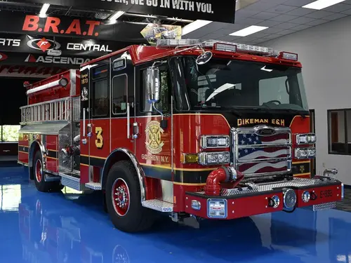 Pumper front-left exterior view showing grille, bumper, and side body