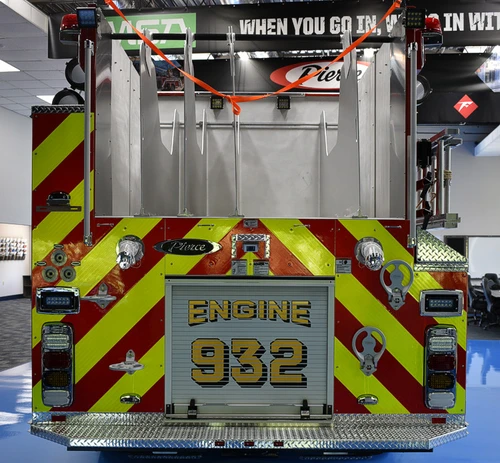 Rear view showing red-and-yellow chevrons and centered unit panel
