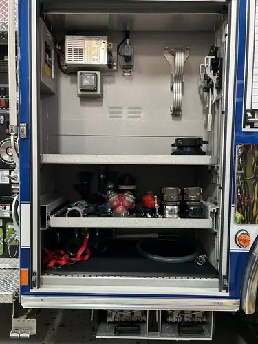 Goshen Pierce Enforcer pumper side compartment with mounted pike poles and hand tools