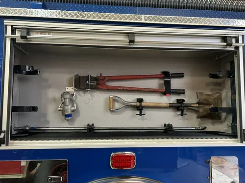 Goshen Pierce Enforcer pumper open side compartment with extinguishers and equipment