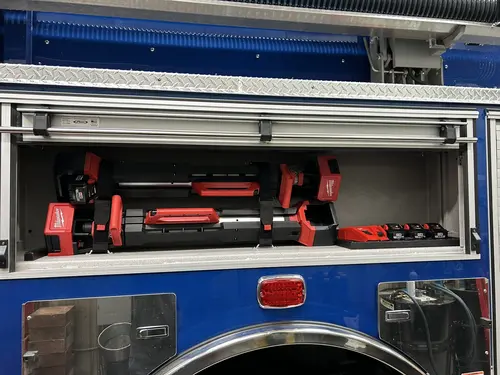 Goshen Pierce Enforcer pumper open lower side compartment with extinguishers
