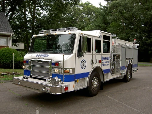 Pumper front-left exterior view showing enclosed cab and side compartments