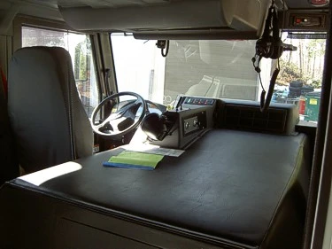 Cab interior command area showing steering wheel and officer-side work surface