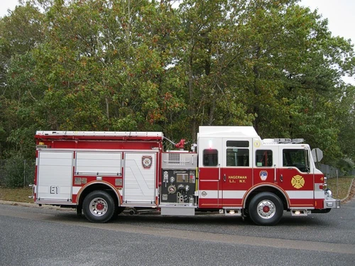 Passenger-side full profile showing pump panel controls, side compartments, and wheel/tire layout.