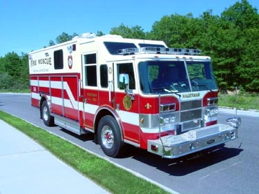 Front-left exterior view of heavy rescue truck showing long body and chrome bumper