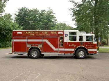 Driver-side profile view showing long rescue body and side compartments