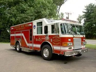 Front-left exterior view showing bumper, cab, and side body compartments