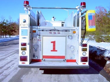 Rear view showing rear panel, warning lights, and lower step