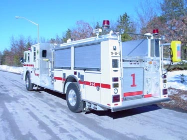 Rear-right exterior view showing side compartments and rear body