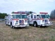 Two-pumper lineup front-left view showing grilles and bumpers