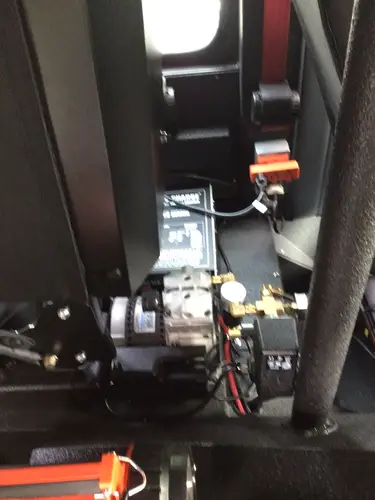 Under-console mechanical assembly close-up with wiring and mounted components