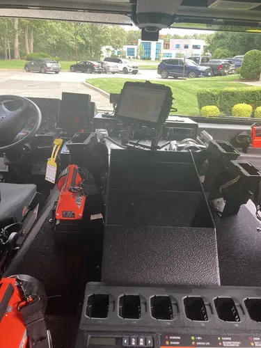 Center console close-up showing tablet screen and charging cradle
