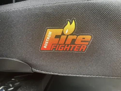 Rear crew bench view showing SCBA seats and red shoulder restraints