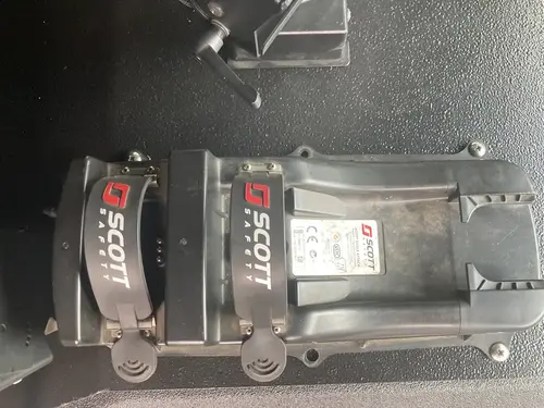 Dual handheld radio charging docks close-up on center console