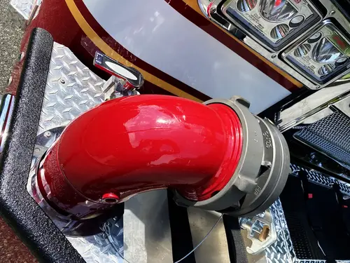 Rear hosebed view showing hose stacks and hosebed rails above chevrons