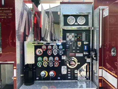 Cab interior rear-to-front view showing crew seating and front console