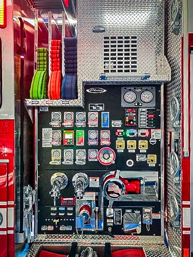 Pump panel close-up showing gauges, valves, and control handles