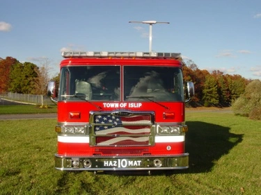 Front exterior view showing grille, bumper, and warning lights