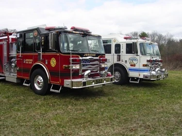 Two-pumper lineup front-left view showing red and white units