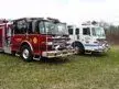Two-pumper lineup front-left view showing red and white units