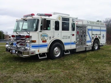 White pumper front-left exterior view showing grille and side body