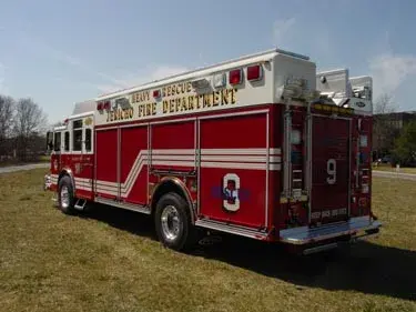 Rear-right exterior view showing side body and rear compartment section