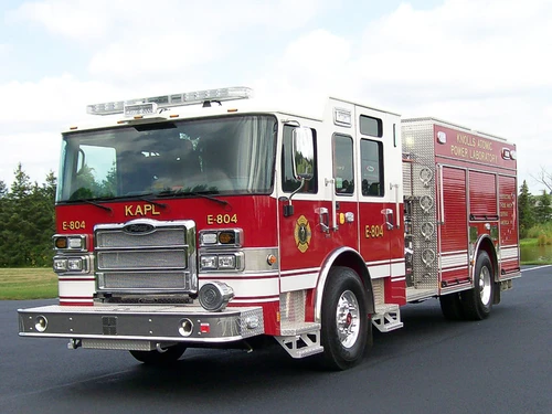 Rescue pumper front-left exterior view showing enclosed cab and side body