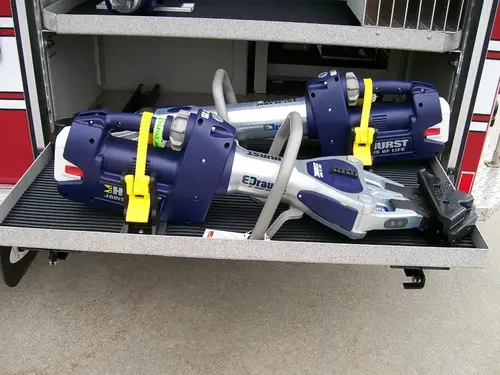 Open side tray showing strapped soft bags and equipment storage