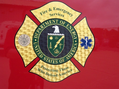 Cab door close-up showing circular crest badge on red panel