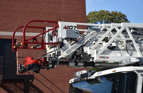 Ladder tip close-up showing front nozzle and red safety rails