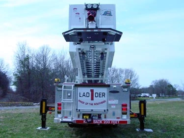 Direct rear view showing ladder base, rear body doors, and outrigger pads